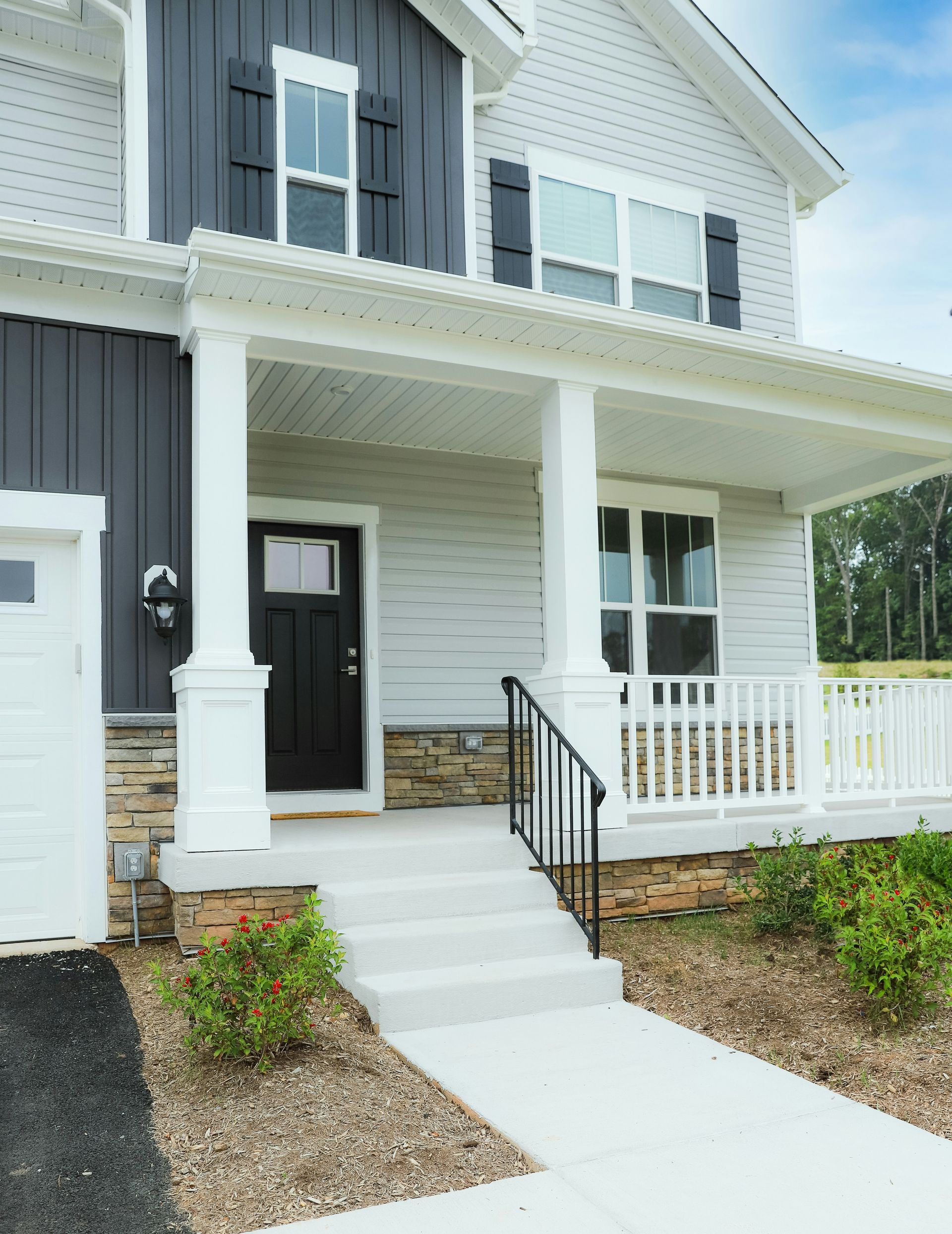 a white house with a black front door